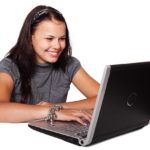 Smiling Girl on Computer